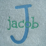 embroidered boys name on ivory baby blanket